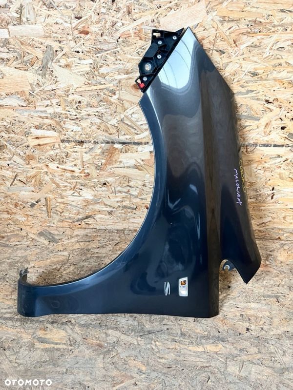 BŁOTNIK lewy OPEL CORSA D