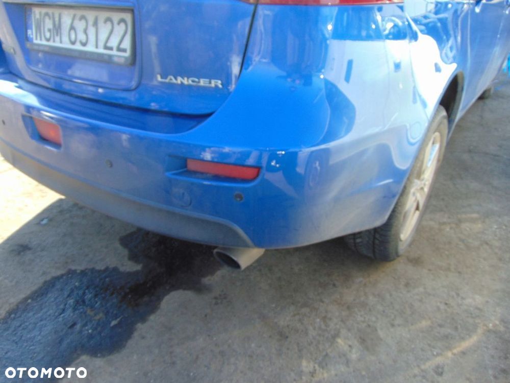 ZDERZAK TYŁ TYLNY MITSUBISHI LANCER VIII D06 - 2