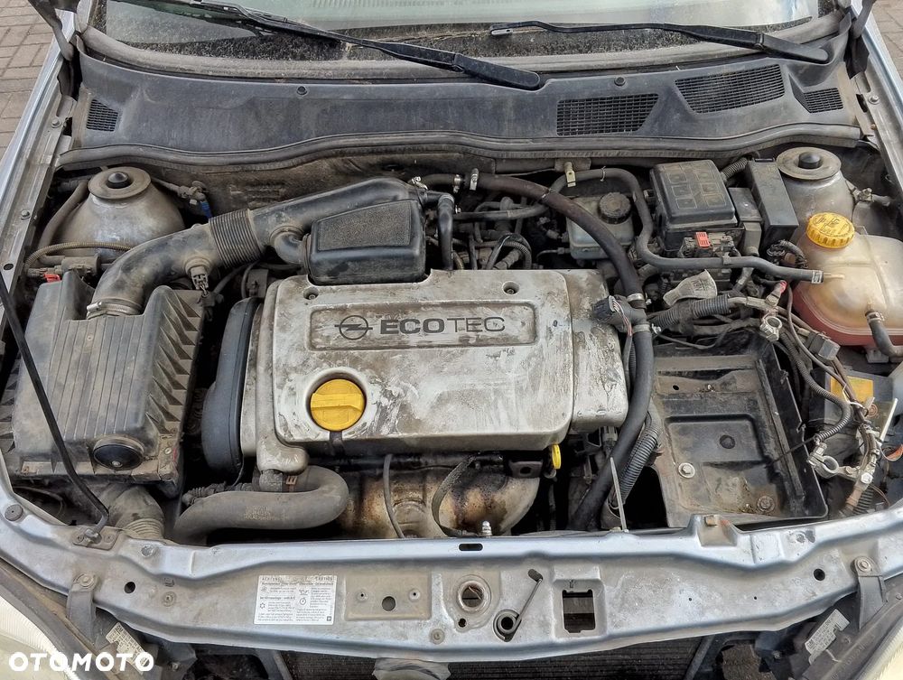 Opel Astra G (04r.) 2.0 HDI 89KM. Silnik Z14XE Skrzynia MG4 lakier 163 / 4AU / GBJ - SILVER LIGHTNING.Cały na części. GWARANCJA !!!  Przód Tył Zestaw Komplet Drzwi Klapa Zderzak Błotnik Maska Grill Atrapa Szyba Pas Lampa Lusterko Boczki Fotel Kanapa Kokpit Deska Rozdzielcza Przełącznik Włącznik Sterownik Przewody Wiązka Instalacja Moduł Komputer Czujnik Listwa Pompa Alternator Wtryski Głowica Rozrusznik Kompresor Sprzęgło Dwumas Silnik Skrzynia ABS Klimatyzacji Paliwa Wspomagania Kolektor Turbina Przepustnica Zawór Chłodnica Koło Hak Belka Sanki Zawieszenie Mcpherson Półoś Amortyzator Wydech Tłumik Zacisk Most - 12
