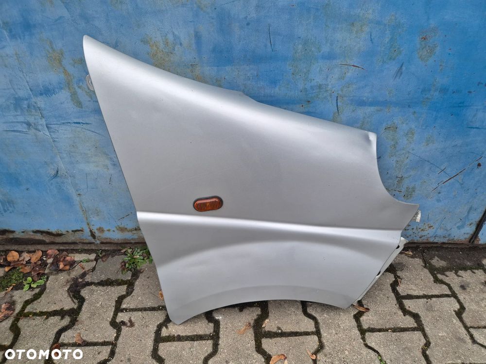 BŁOTNIK PRAWY CMG64 L147 TRAFIC VIVARO PRIMASTAR  01-14r.