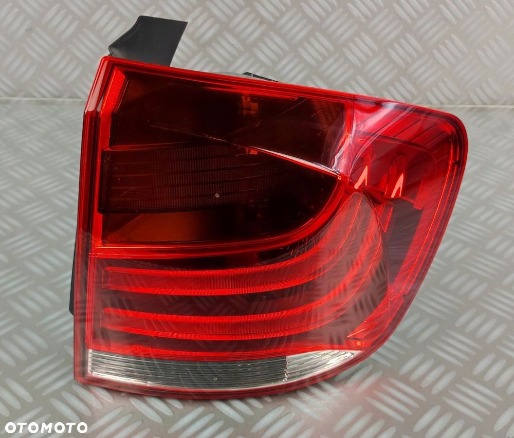 2990110 lampa prawa prawy tył tylna w błotnik BMW X1 E84 2009-2015 EUROPA - 1