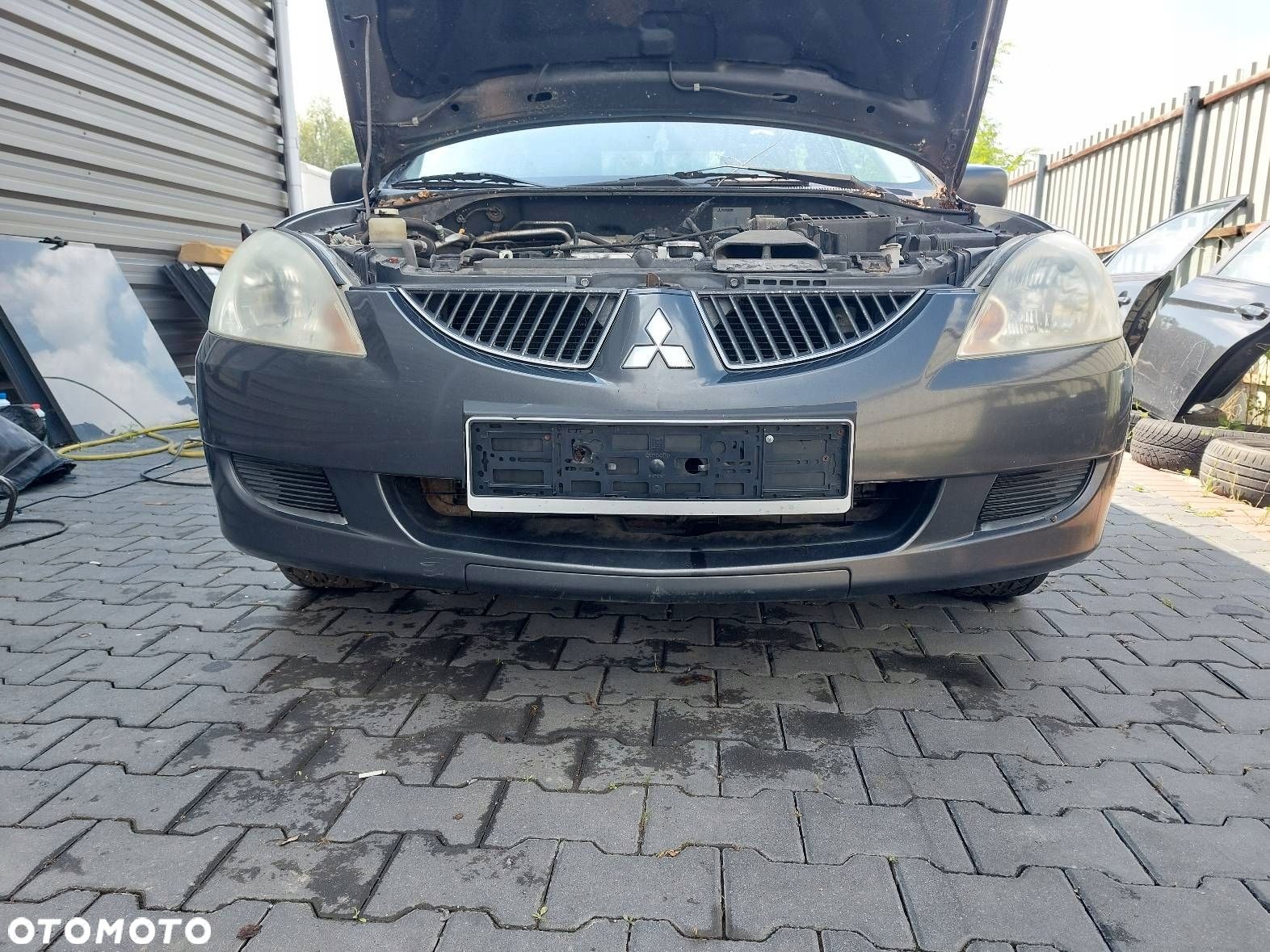 ZDERZAK PRZÓD PRZEDNI MITSUBISHI LANCER VII A02A - 1