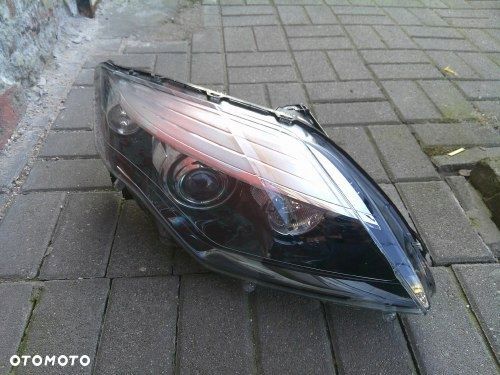 RENAULT LAGUNA III LIFT 10 XENON PRAWA PRZEDNIA LAMPA ORYGINAŁ 260105295R - 1