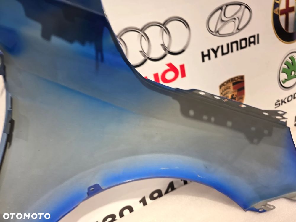 OPEL CORA F 19- LEWY BŁOTNIK PRZEDNI PRZÓD NR AUKCJI BŁ322 - 20