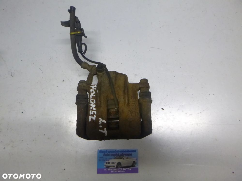 ZACISK LEWY TYŁ POLONEZ FSO CARO 1,6B  1996r - 1