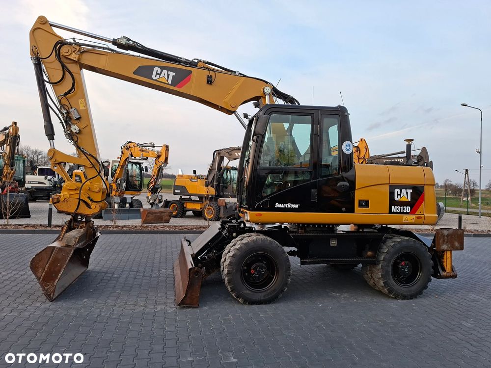 Caterpillar CAT M313D Niwelacja 3D Leica - 1