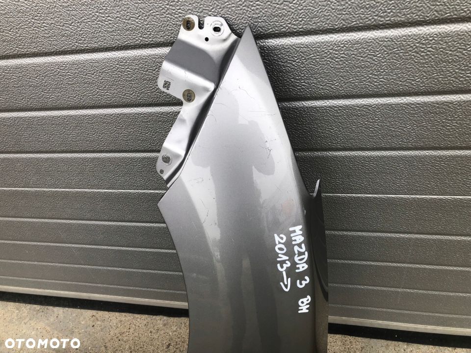 BŁOTNIK PRZEDNI LEWY MAZDA 3 BM 2013-- - 2