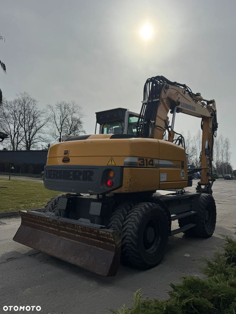 Liebherr 314 Litronic Rotator - 5