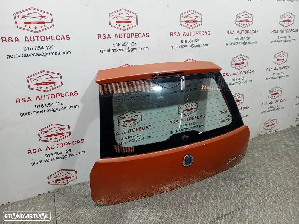 Tampa de Mala Fiat Grand Punto 199 Original - 2