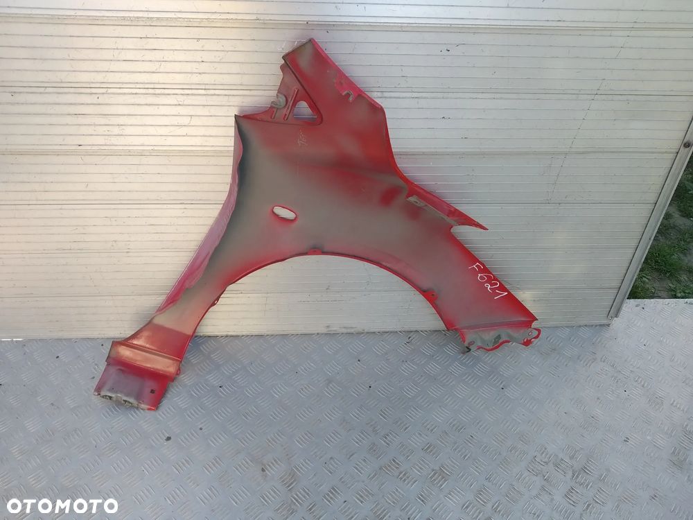 F621/H339/H615 LEWY BŁOTNIK MAZDA 2 2008-14 - 2