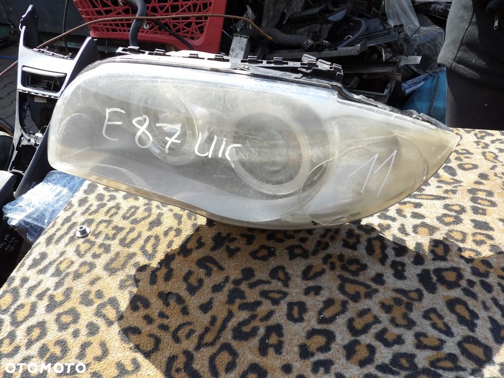 BMW - E87 - LIFT - XENON - LEWA LAMPA PRZEDNIA - PĘKNIĘTE SZKŁO - OBUDOWA - URWANE UCHO - UK - 7180833 - 1