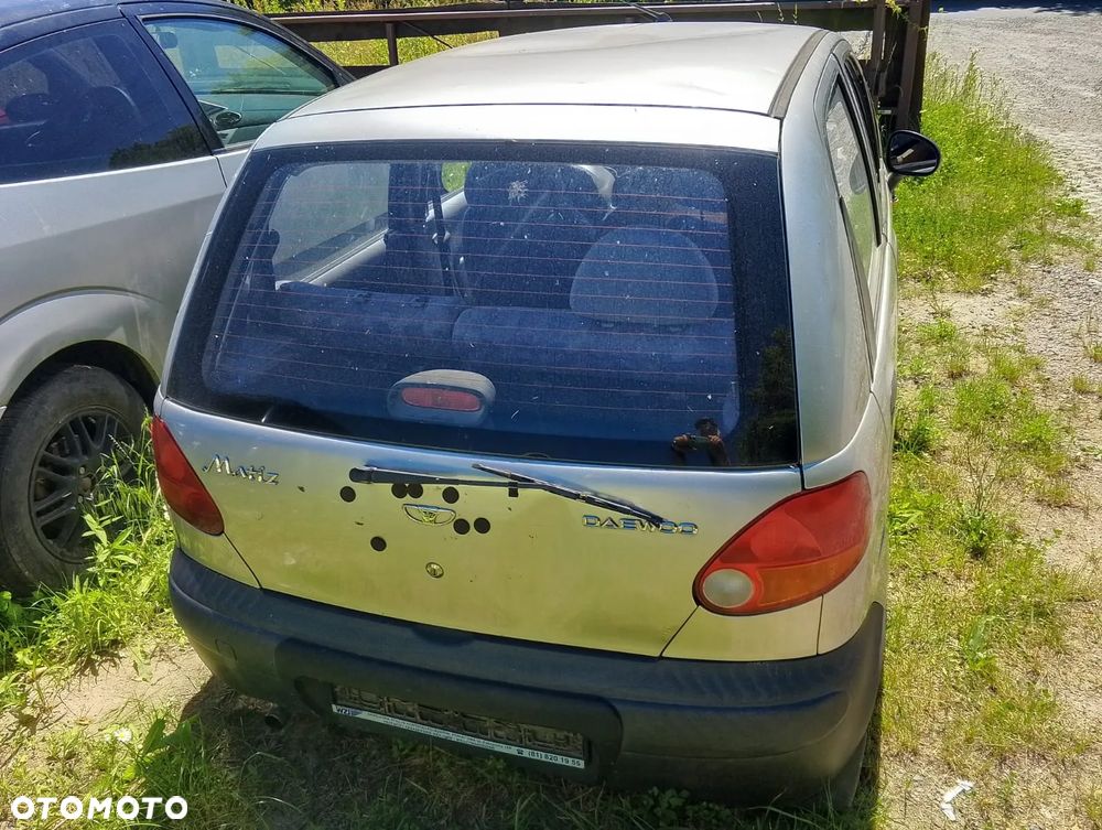 Daewoo Matiz M100 (98-07r.) 0.8 B 51KM. Silnik F8CV Skrzynia.Cały na części. GWARANCJA !!!  Przód Tył Zestaw Komplet Drzwi Klapa Zderzak Błotnik Maska Grill Atrapa Szyba Pas Lampa Lusterko Boczki Fotel Kanapa Kokpit Deska Rozdzielcza Przełącznik Włącznik Sterownik Przewody Wiązka Instalacja Moduł Komputer Czujnik Listwa Pompa Alternator Wtryski Głowica Rozrusznik Kompresor Sprzęgło Dwumas Silnik Skrzynia ABS Klimatyzacji Paliwa Wspomagania Kolektor Turbina Przepustnica Zawór Chłodnica Koło Hak Belka Sanki Zawieszenie Mcpherson Półoś Amortyzator Wydech Tłumik Zacisk Most - 3