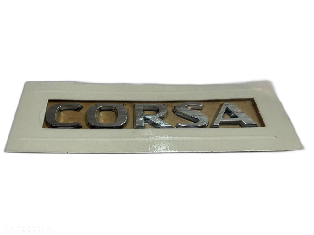 OPEL CORSA F EMBLEMAT NAPIS KLAPY TYŁ  NOWY ORYGINAŁ 9829773080 - 1