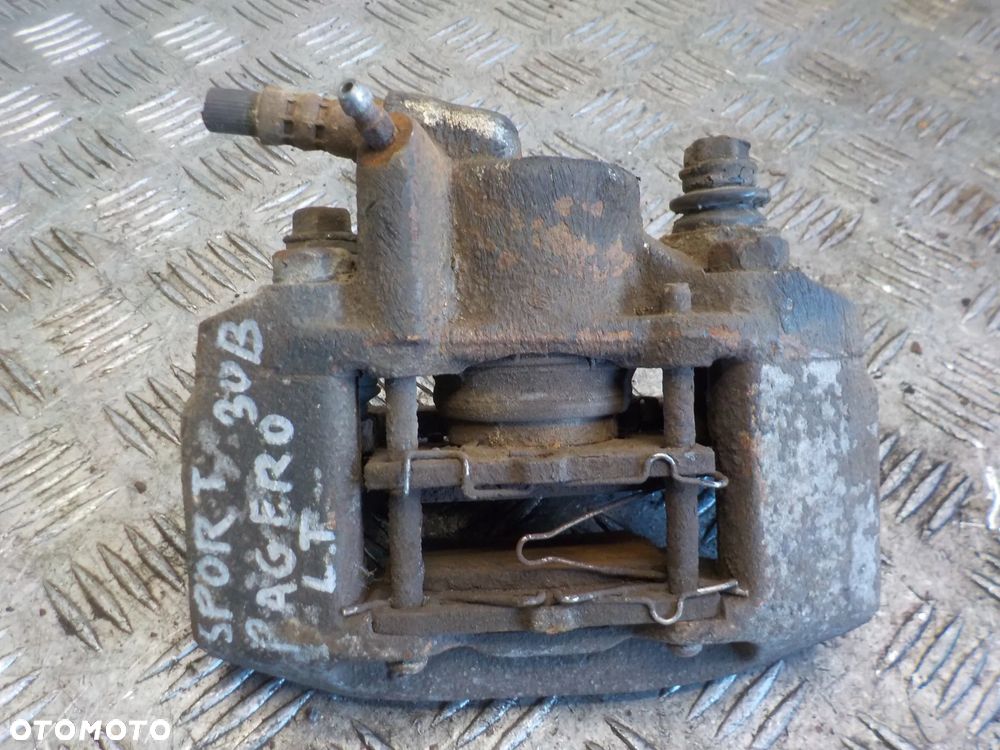 MITSUBISHI PAJERO SPORT 3.0 B ZACISK HAMULCOWY LEWY TYŁ - 1