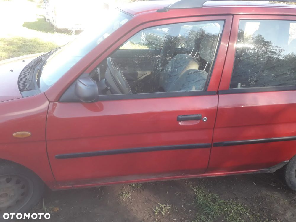 Mazda Demio 97-03 Drzwi prawe przednie tył błotnik w kolor SU  szyba zderzak lampaprzód - 3