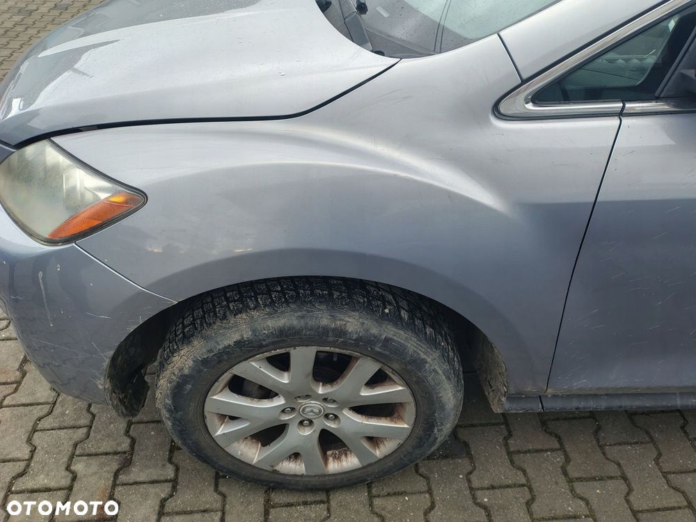 MAZDA CX7 BŁOTNIK LEWY PRZÓD PRZEDNI - 1