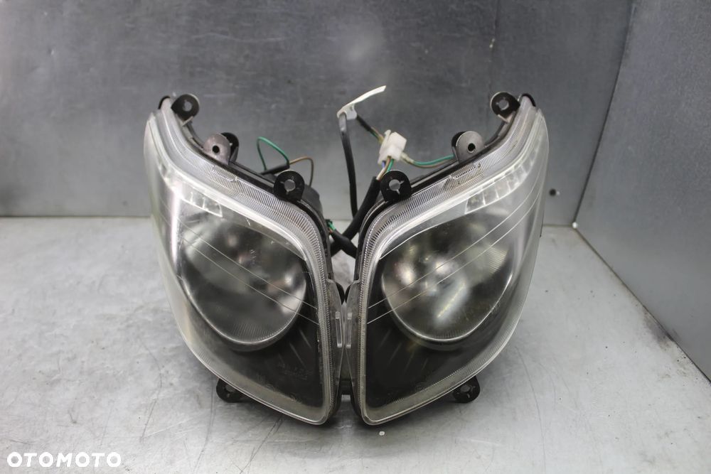Sym GTS 125 Evo FI 09r Lampa przód przednia reflektor lewy prawy komplet