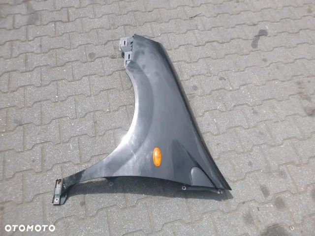 BŁOTNIK LEWY PRZÓD LEWY PRZEDNI NISSAN ALMERA TINO