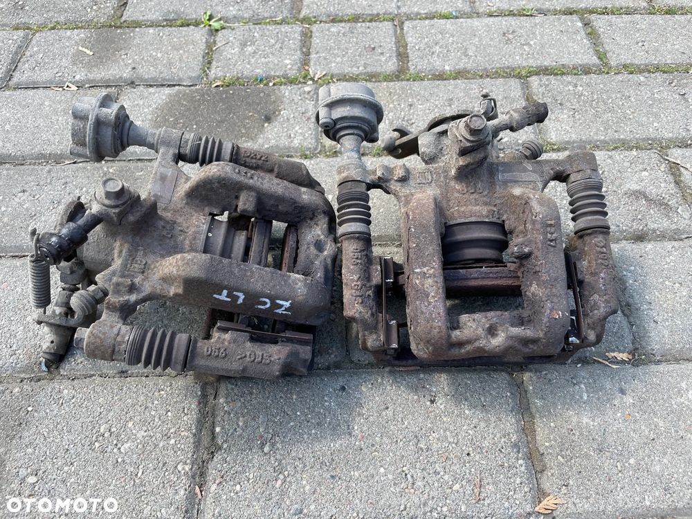 OPEL Astra J Zafira C zacisk hamulcowy + jarzmo lewy prawy tył - 1