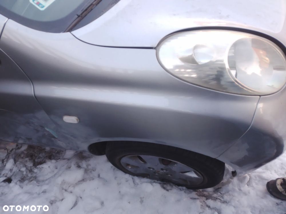 NISSAN MICRA K12 03-07 1.2 16V  LUSTERKO ZEWNĘTRZNE LEWE   KY0 G - 7