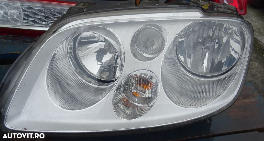 Far stanga Volkswagen Touran din 2003 volan pe stanga - 1