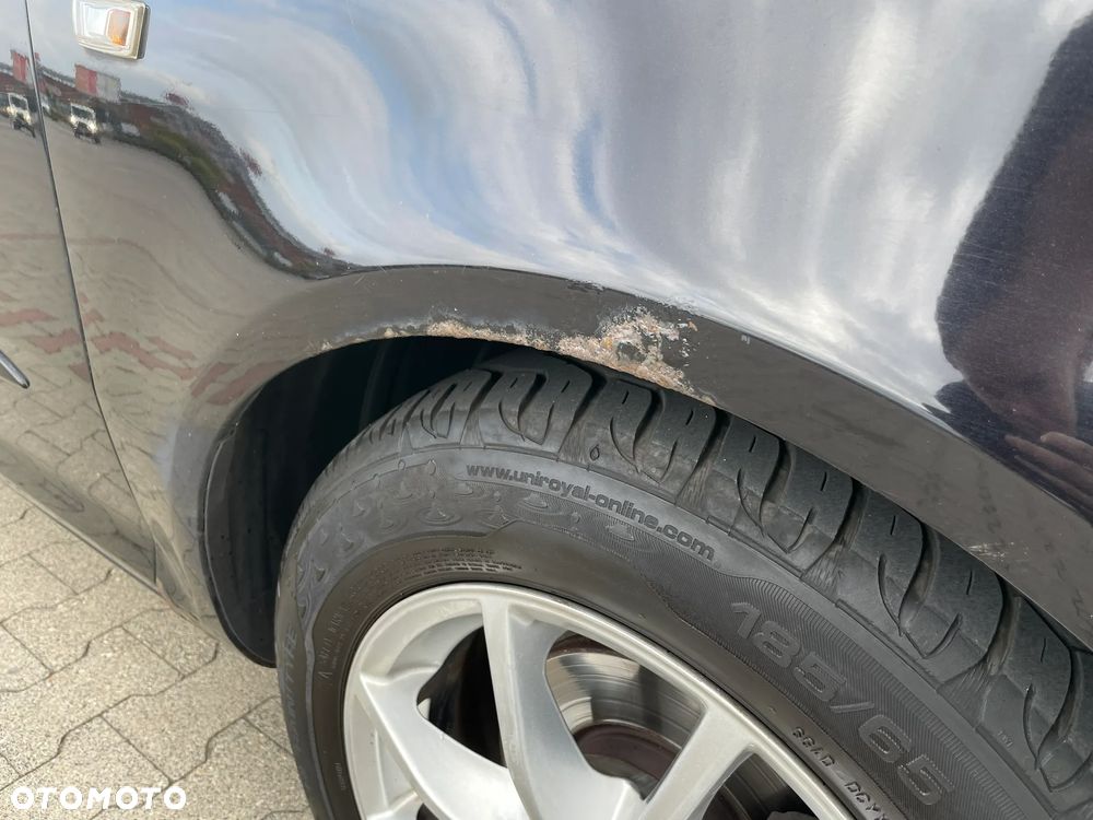 Opel Corsa 1.4 16V Cosmo - 8