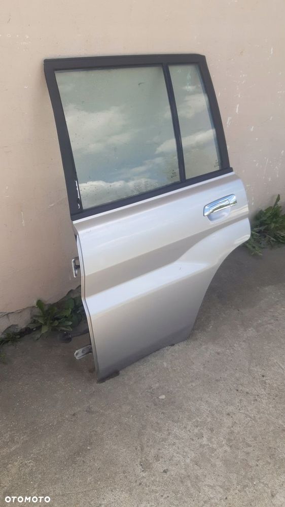 Drzwi lewy tyl MITSUBISHI PAJERO PININ 98-07r - 2