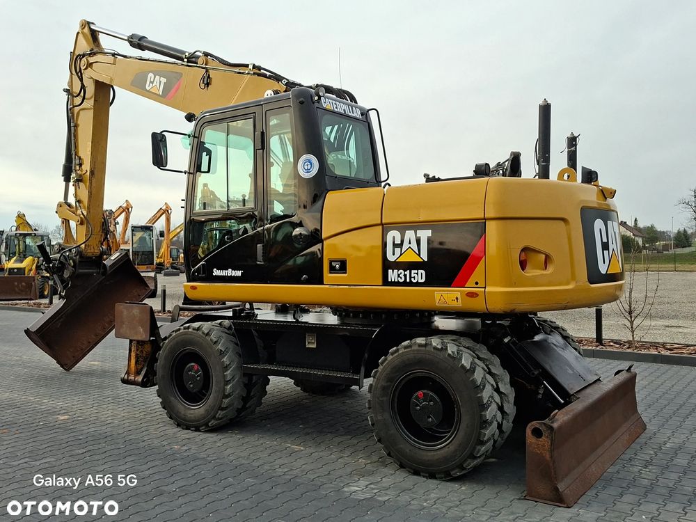 Caterpillar CAT M315D rok 2012 - 1