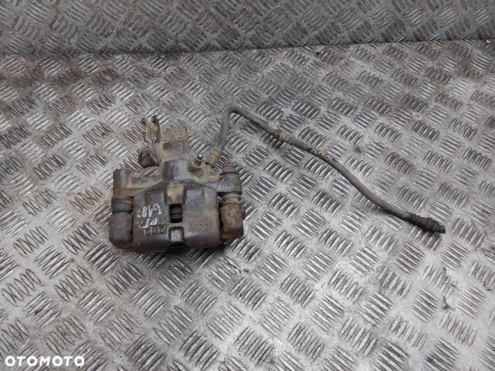 ZACISK HAMULCOWY PRAWY TYŁ MAZDA PREMACY I - 1