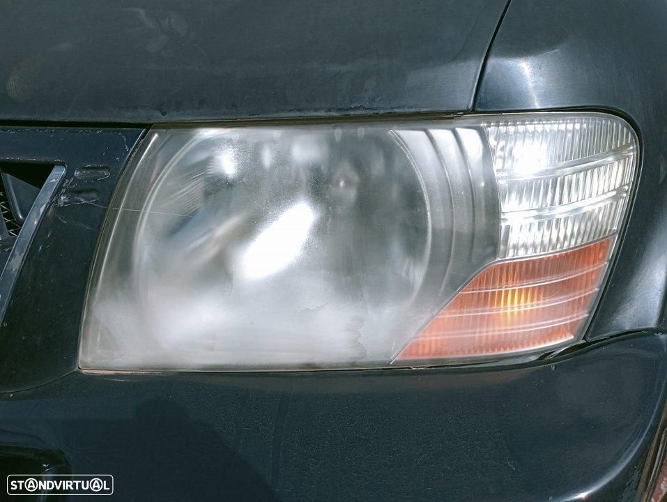 FAROL ESQUERDO MITSUBISHI MONTERO V60V70 - 1