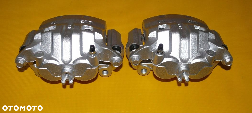 ZACISKI JARZMA LEWY PRAWY PRZÓD NISSAN PATHFINDER III 3 R51 296/28mm 04-10r - 8