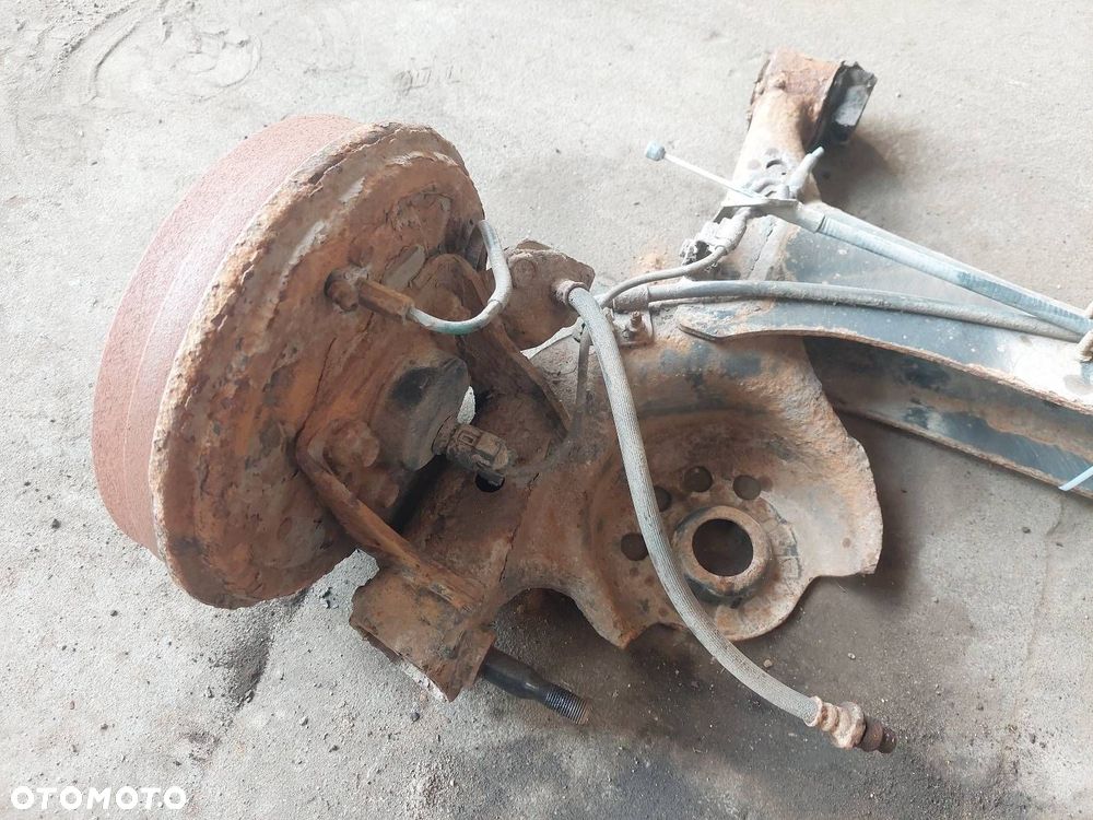 BELKA OŚ ZAWIESZENIA TYŁ BĘBNY Z ABS TOYOTA YARIS I ID: 238000 - 6
