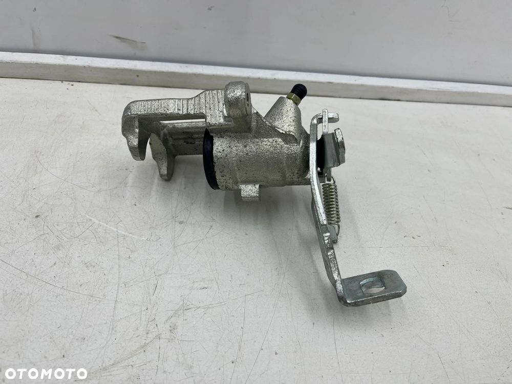 Zacisk hamulcowy Nissan Almera N16 Almera Tino Primera P11 96-06r. NOWY prawy tylny zacisk prawy tył - 5