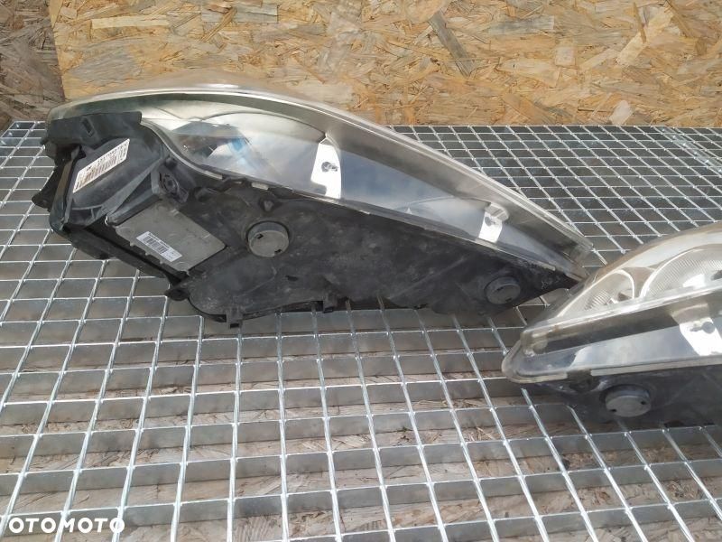 REFLEKTOR 2 SZT KPL EUROPA BIKSENON SKRĘTNY OPEL VECTR C LIFT 13170934 - 13