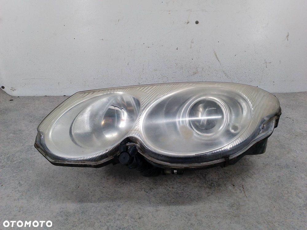 LAMPA PRZÓD LEWA CHRYSLER 300M 04780003AC - 2