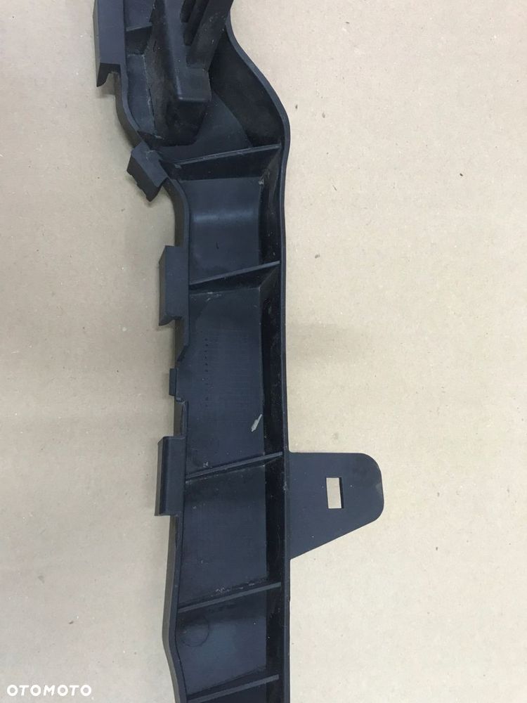 OPEL MERIVA B ŚLIZG WSPORNIK POD LAMPĘ PRAWY LUB LEWY GM - 9