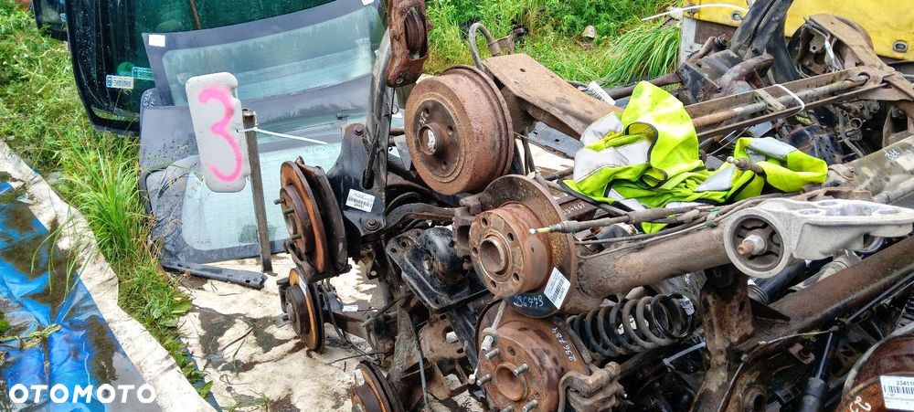 BELKA OŚ ZAWIESZENIA TYŁ BĘBNY Z ABS OPEL CORSA C - 7