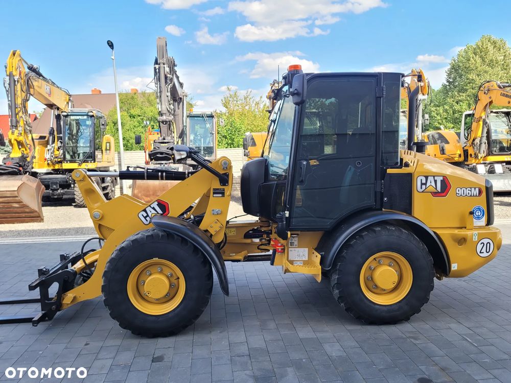 Caterpillar 906M / nowy model 2022r. / łyżka otwierana + widły / SUPER STAN
