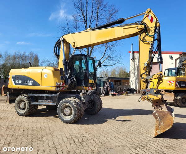 Caterpillar M 318 / Z Niemiec /