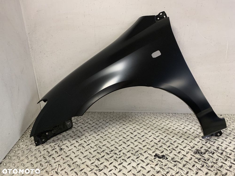 NOWY ORYGINALNY BŁOTNIK LEWY PRZEDNI PRZÓD TOYOTA COROLLA E12 HB 02-09 - 2