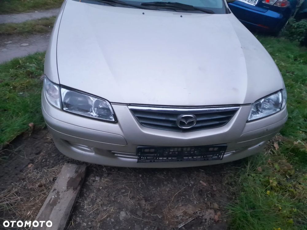 Mazda 626 GF GW 97-02 LIFT    Maska lampa zderzak pas atrapa zamek mocowanie  kolor 4F
