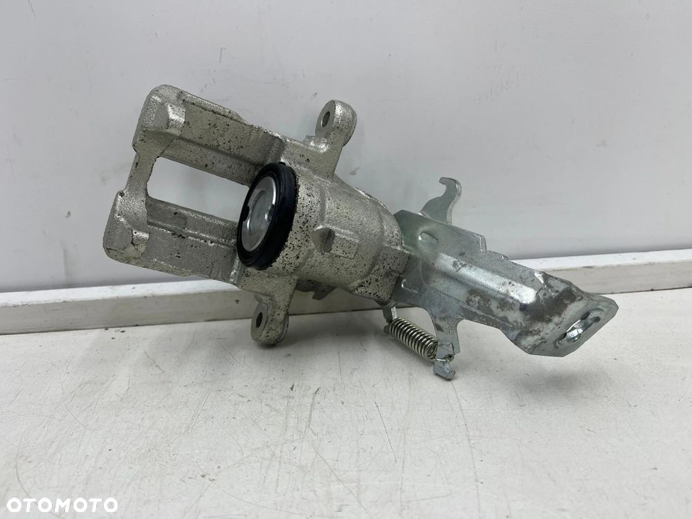 Zacisk hamulcowy Nissan Almera N16 Almera Tino Primera P11 96-06r. NOWY prawy tylny zacisk prawy tył - 1