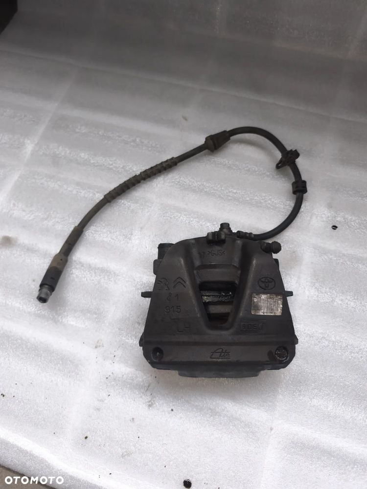 Zacisk lewy przód citroen Jumpy Peugeot Expert Toyota Proace Vivaro PSA 9805256280 2016-2024 - 1