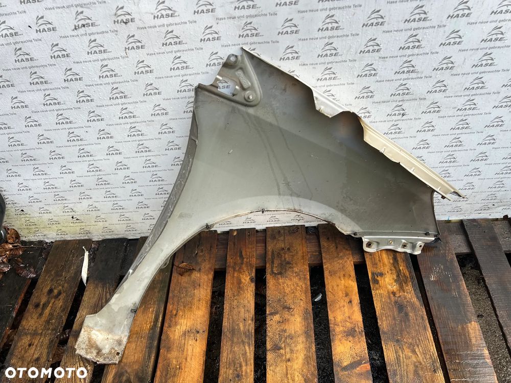 Toyota Sienna II FL błotnik lewy przód przedni - 8