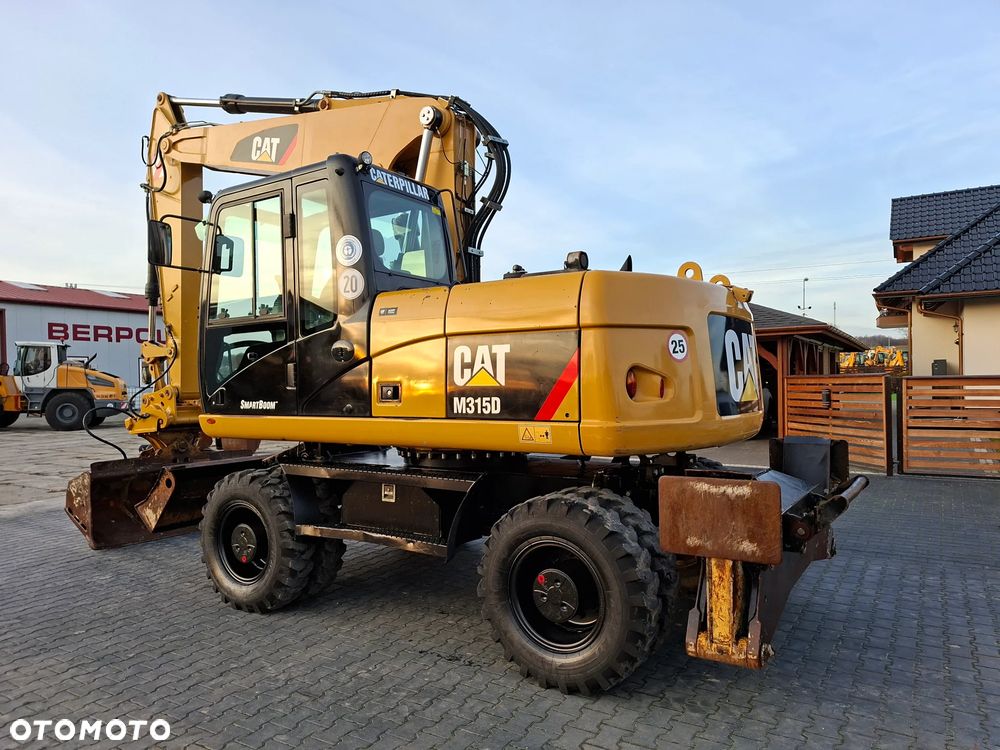 Caterpillar CAT M315D Rok 2011 - 1