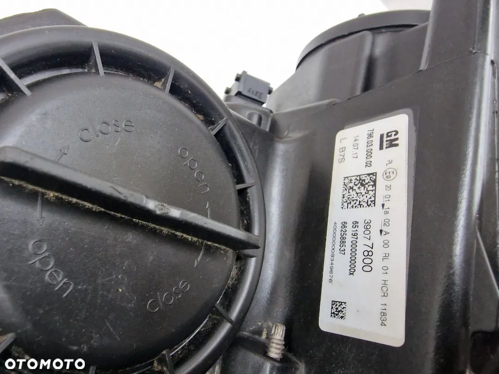 OPEL ASTRA V K 5 15- LEWA SOCZEWKA ZWYKŁA NR 39077800 , NR AUKCJI LL551 - 15