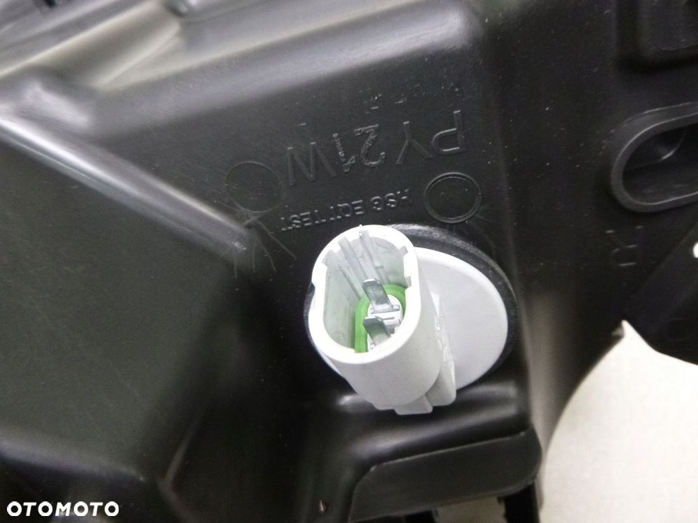 DACIA LOGAN 08-13 LAMPA PRAWY PRZÓDPRZEDNIA ORYGINAŁ - 14