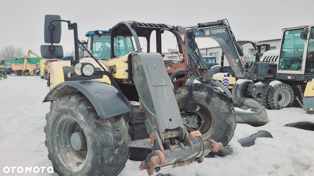 Spalona ładowarka New Holland TH 6.32 na części - 11