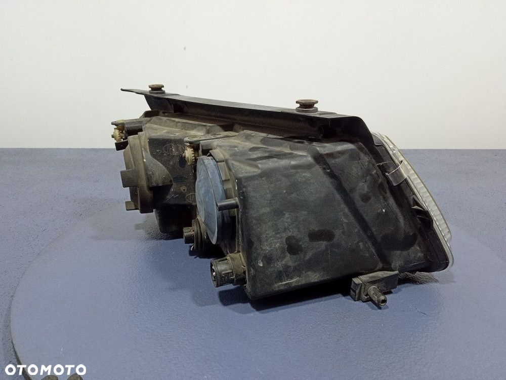 VW PASSAT B5 96-00 REFLEKTOR LEWY H7 EU 147425-00 - 3