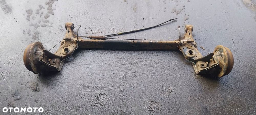 BELKA OŚ ZAWIESZENIA TYŁ BĘBNY BEZ ABS OPEL CORSA C - 1